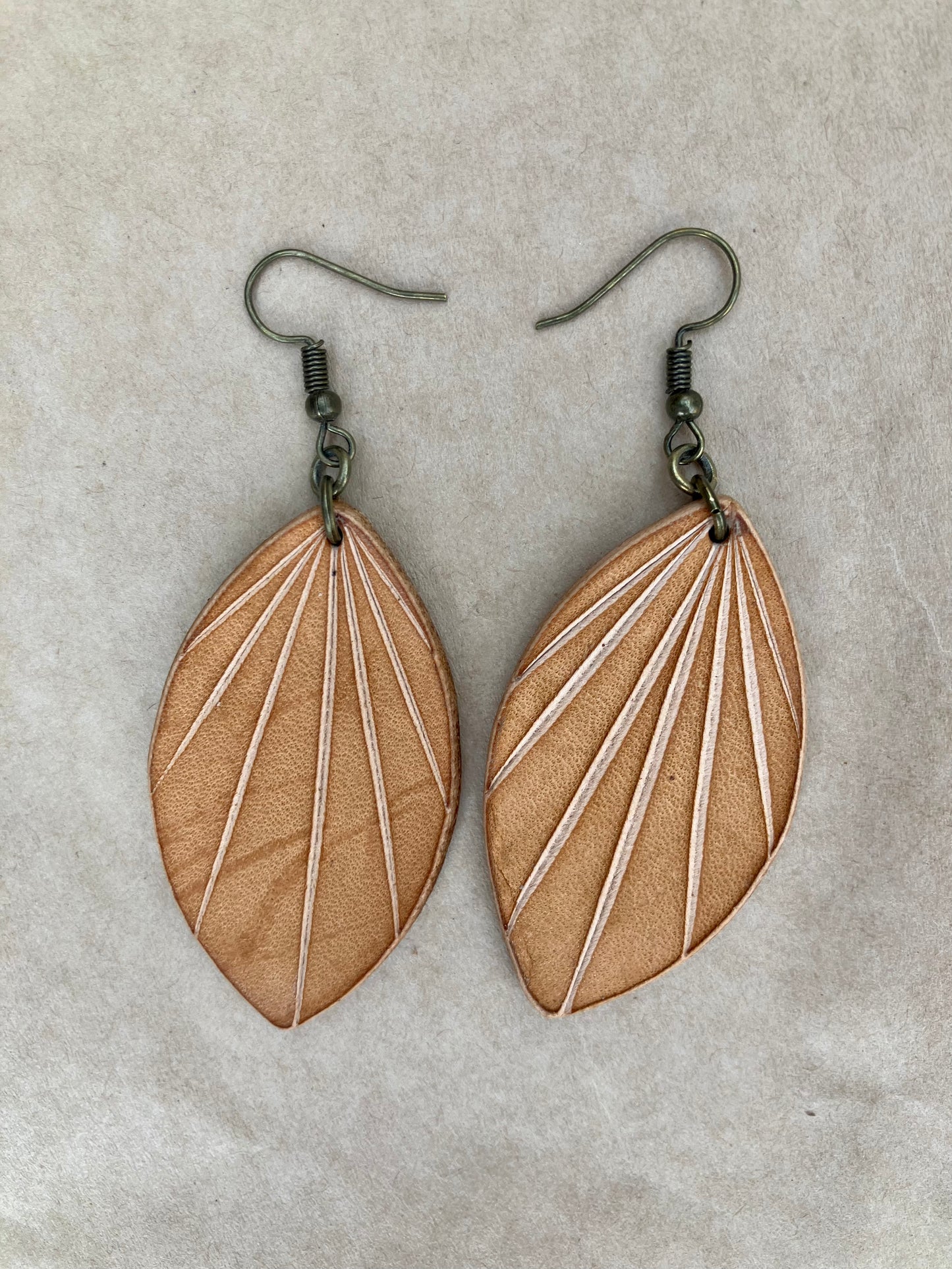lightweight leather earrings with embossed lines; hypoallergenic, nickel free; antique brass; 3 inch high; handmade.