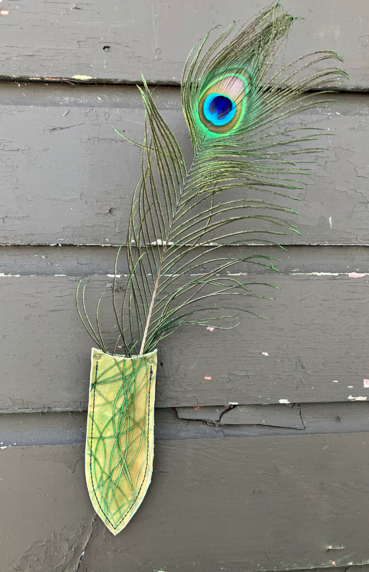 a wilder leather handcrafted leather air vase is perfect for dried flowers or other things you wish to suspend on the wall.