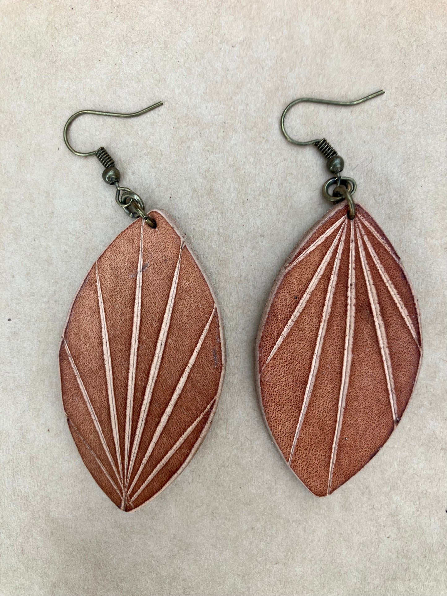 lightweight leather earrings with embossed lines; hypoallergenic, nickel free; antique brass; 3 inch high; handmade.