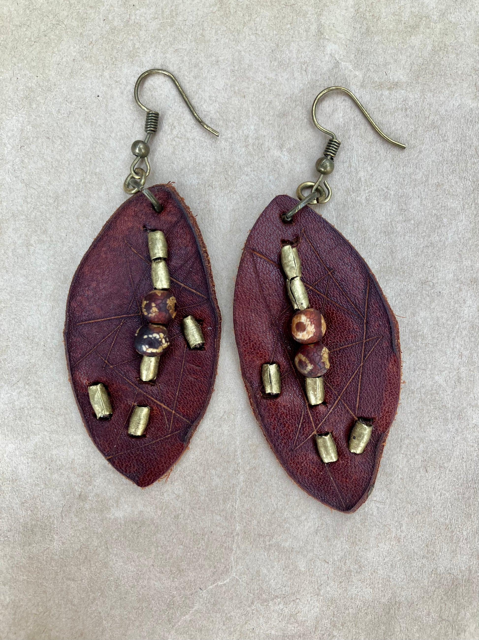 lightweight leather earrings with embossed lines; hypoallergenic, nickel free; antique brass and agate beads; 3 inch high; handmade.