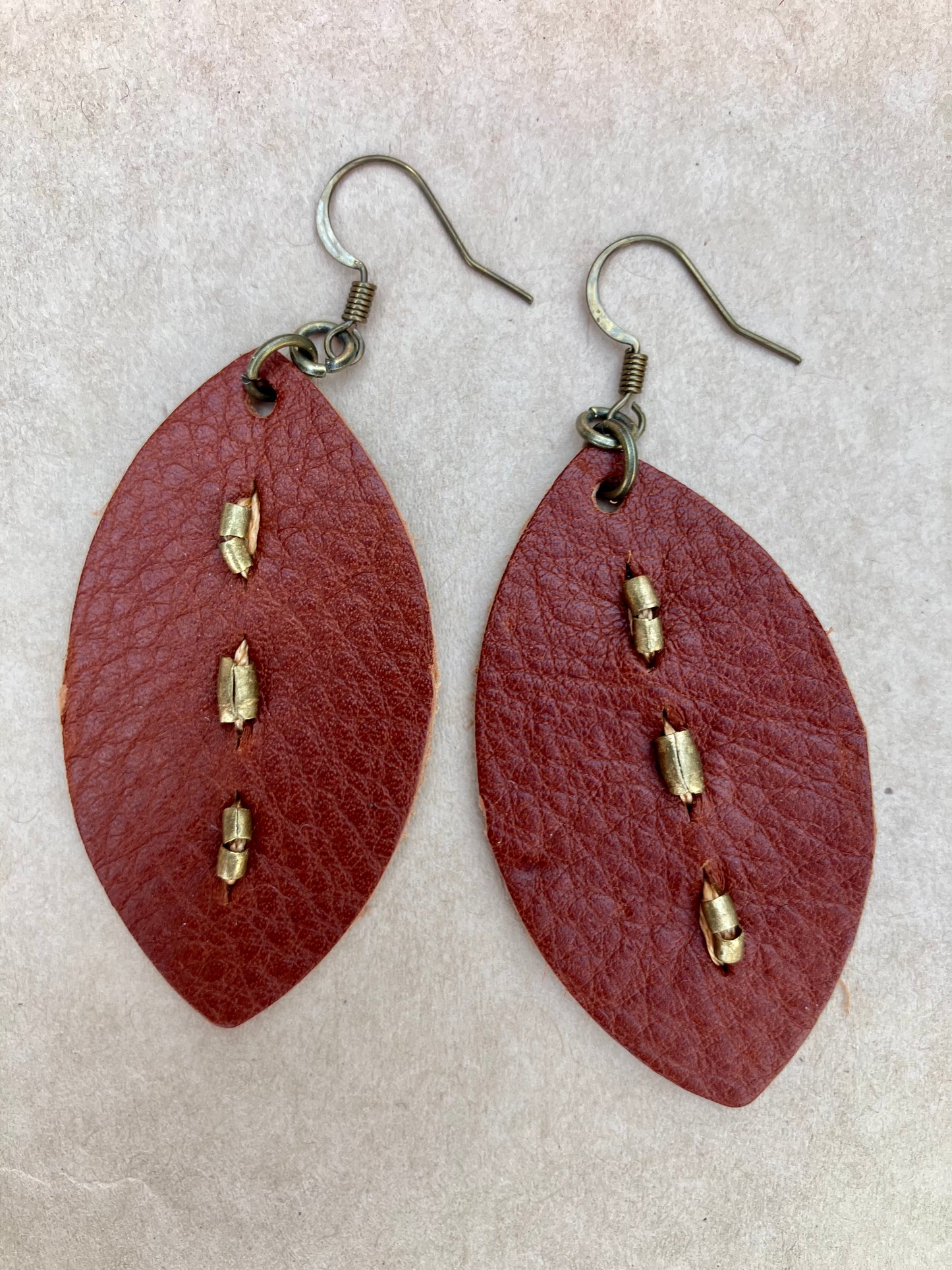 lightweight leather earrings with antique brass; hypoallergenic, nickel free; 3 inch high; handmade.