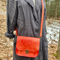 handmade leather bag/belt-bag hybrid with crossbody strap in orange by Wilder Leather
