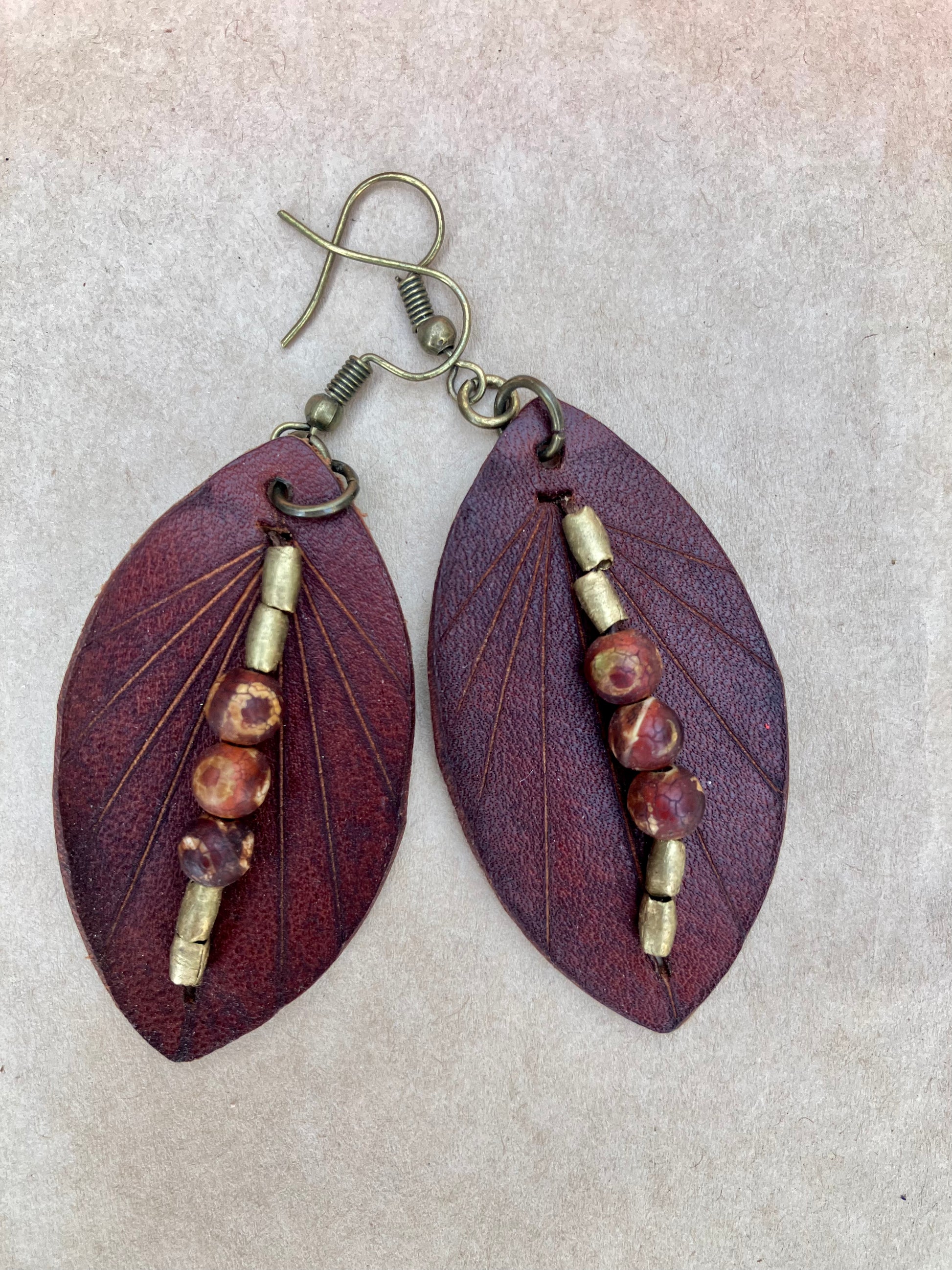 lightweight leather earrings with embossed lines; hypoallergenic, nickel free; antique brass and agate beads; 3 inch high; handmade.