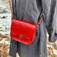 red slash embosssed handmade leather bag/belt-bag hybrid with crossbody strap by Wilder Leather.