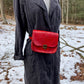 red slash embosssed handmade leather bag/belt-bag hybrid with crossbody strap by Wilder Leather.
