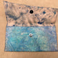 x cut clutch/pouch in blues and greens, leather, handmade by Wilder Leather