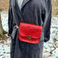 red slash embosssed handmade leather bag/belt-bag hybrid with crossbody strap by Wilder Leather.