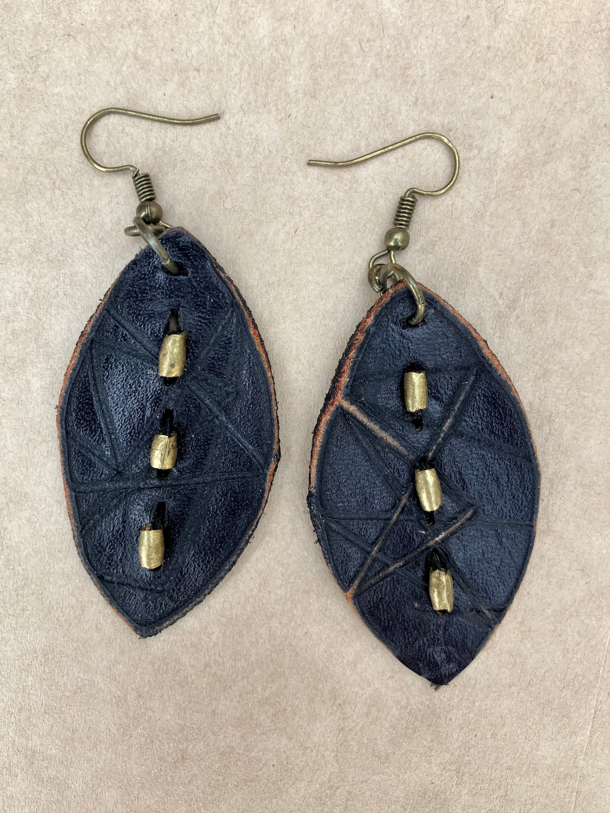 lightweight leather earrings with embossed lines; hypoallergenic, nickel free; antique brass; embossed; 3 inch high; handmade.