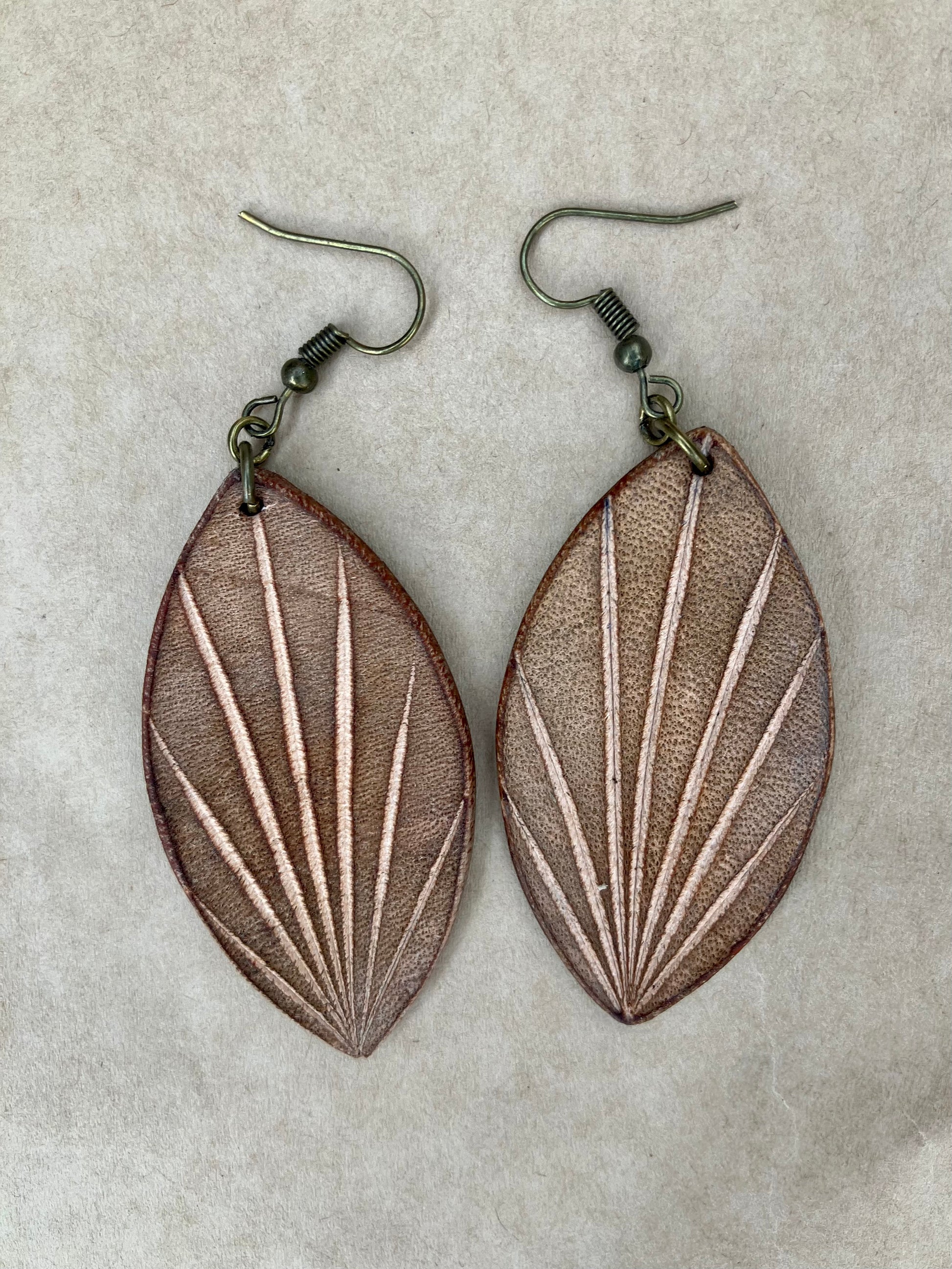 lightweight leather earrings with embossed lines; hypoallergenic, nickel free; antique brass; 3 inch high; handmade.