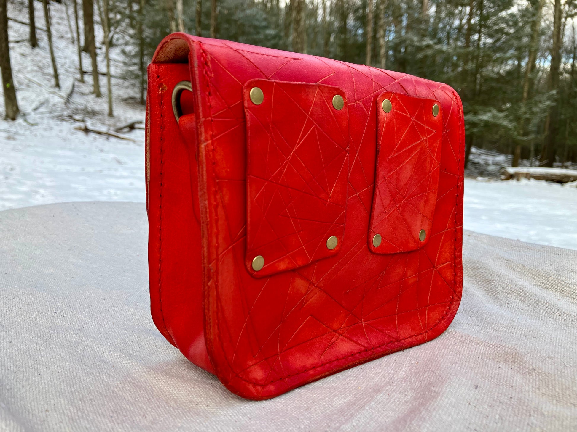 red slash embosssed handmade leather bag/belt-bag hybrid with crossbody strap by Wilder Leather.