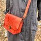 handmade leather bag/belt-bag hybrid with crossbody strap in orange by Wilder Leather